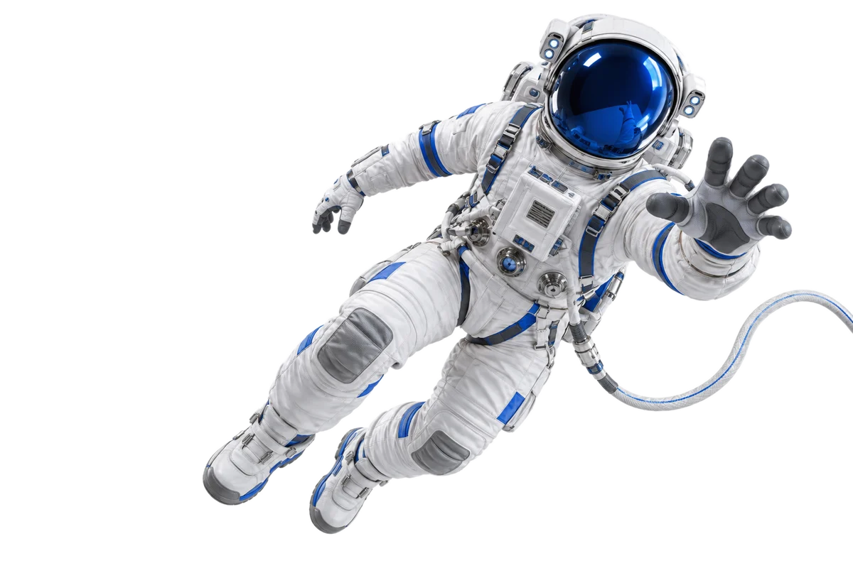 An astronaut floating, tethered and reaching forward